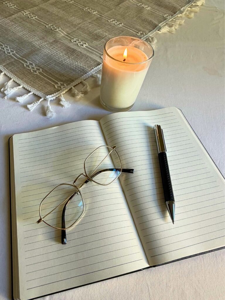 open journal on table with soft natural light and minimal setting
