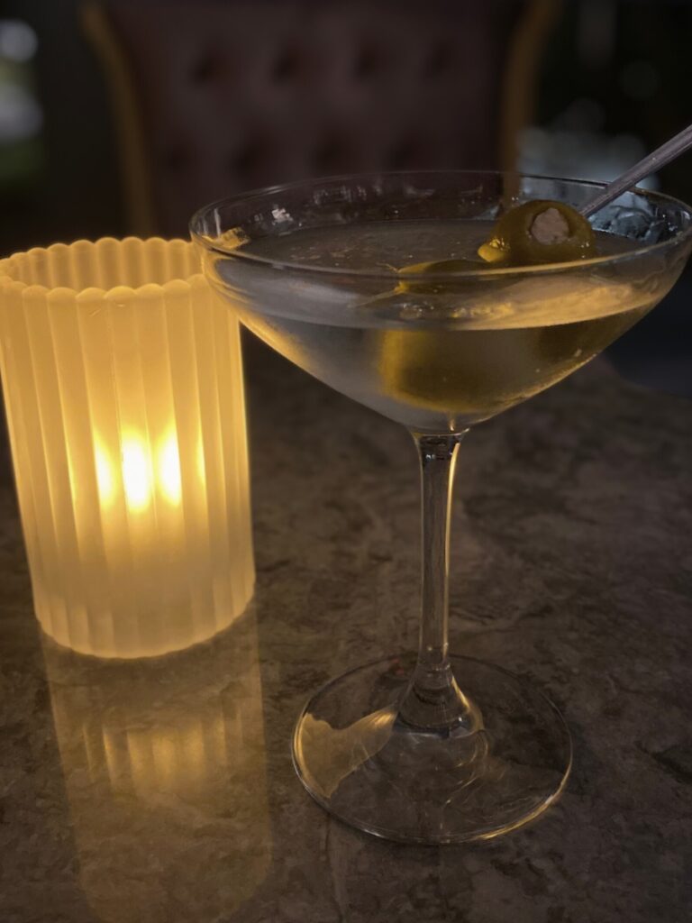 candlelit table with drinks creating a warm and intimate setting